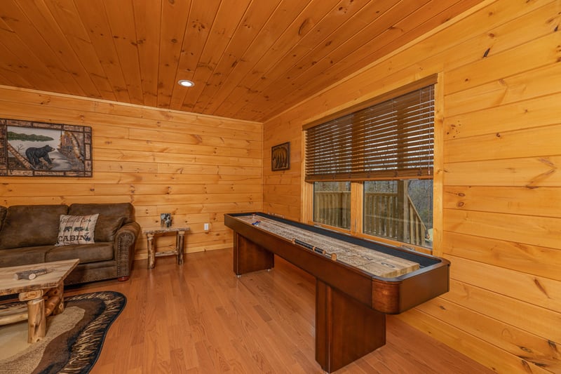 Shuffleboard game at Js Hideaway, a 4 bedroom cabin rental located in Pigeon Forge