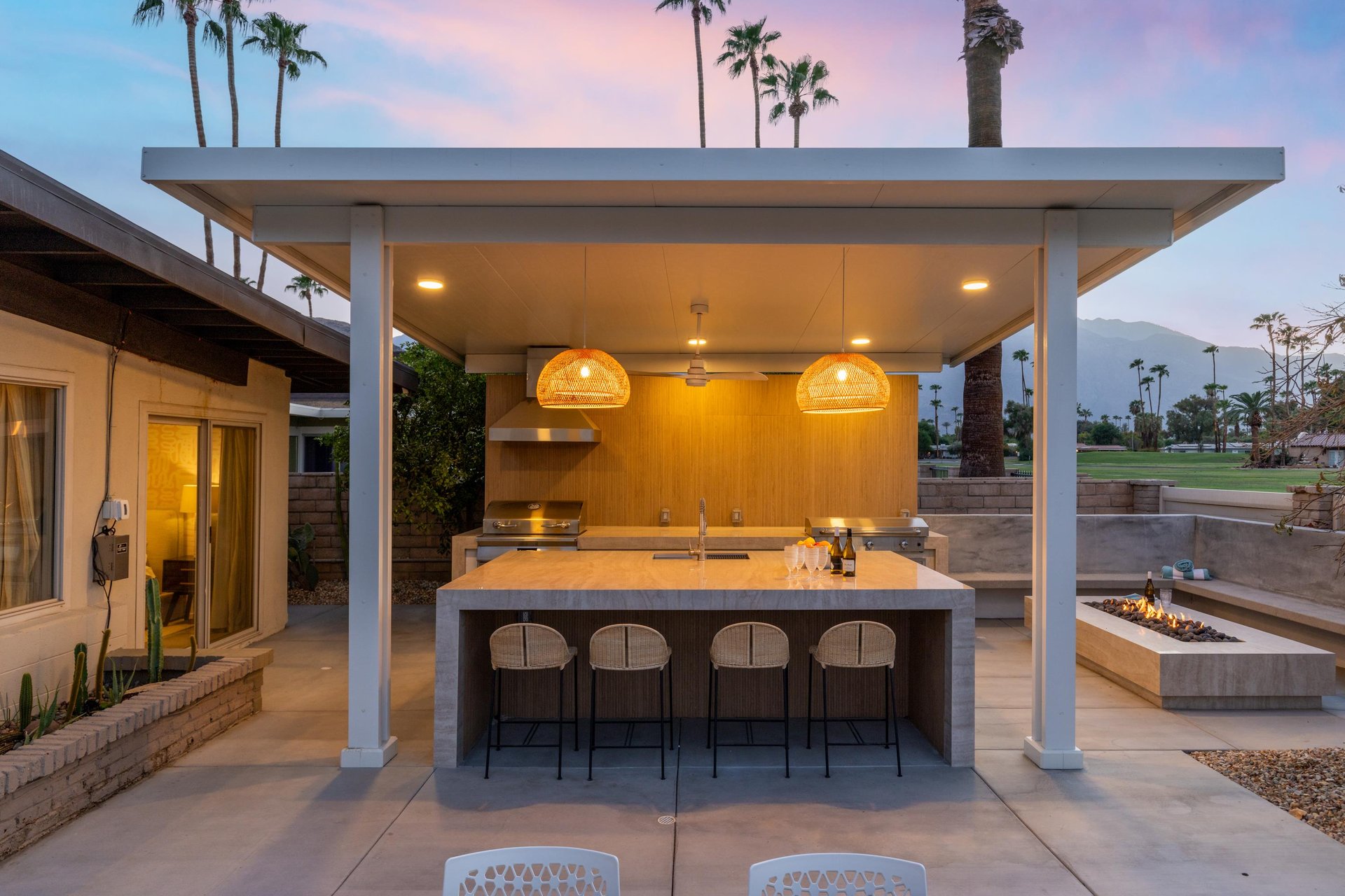 Features a BBQ, plenty of counter space, counter seating for 4, and a firepit all overlooking the golf course.