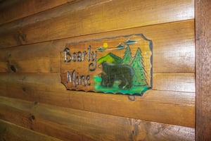 Custom welcome sign at Bearly Mine, a 1bedroom cabin rental in Pigeon Forge