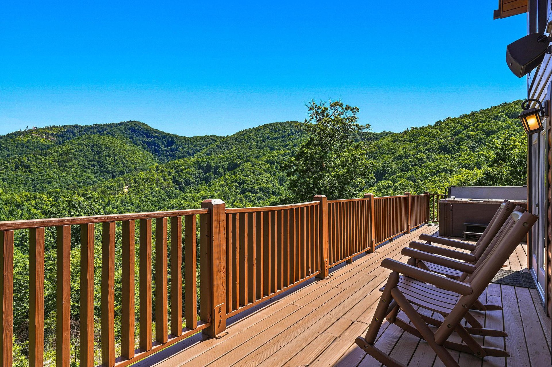 A secluded mountain property surrounded by lush forested hills offers peaceful natural beauty and scenic views.