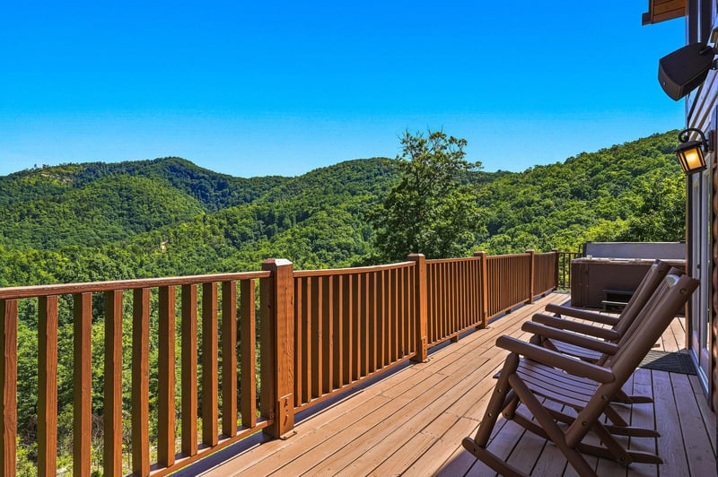 A secluded mountain property surrounded by lush forested hills offers peaceful natural beauty and scenic views.