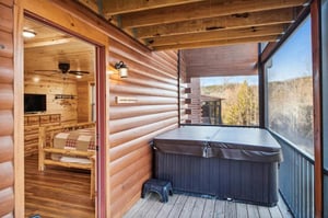 Unwind in your private hot tub while soaking in stunning mountain views from this enclosed porch.