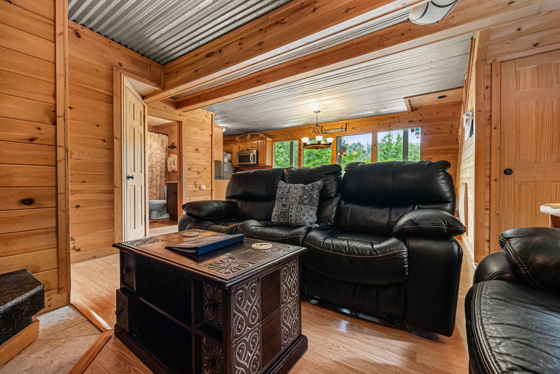 Sofa in the living room at License to Chill, a 3 bedroom cabin rental located in Gatlinburg
