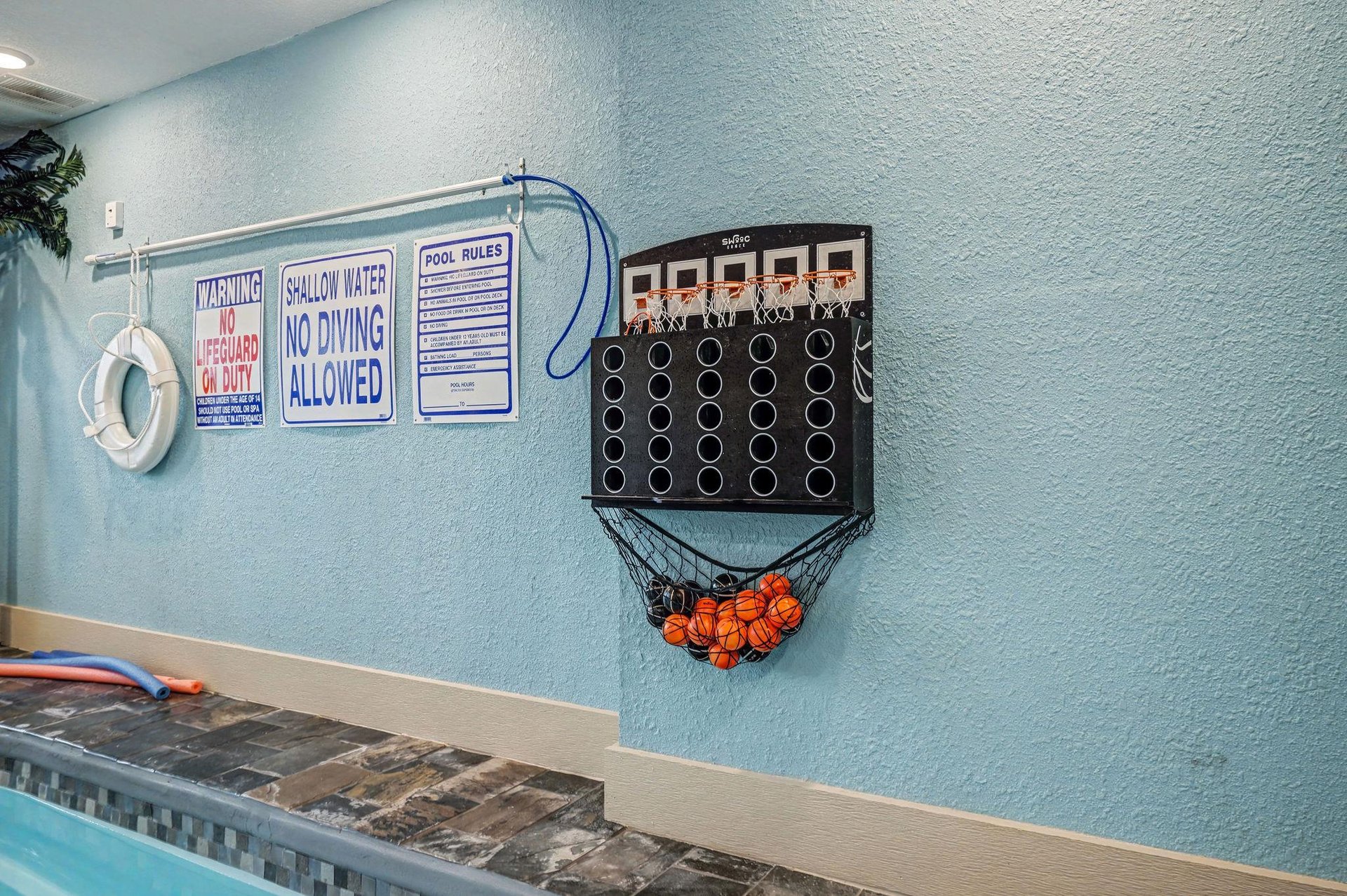 Challenge friends to pool basketball while you soak up the fun—this interactive game wall turns your swim time into friendly competition.