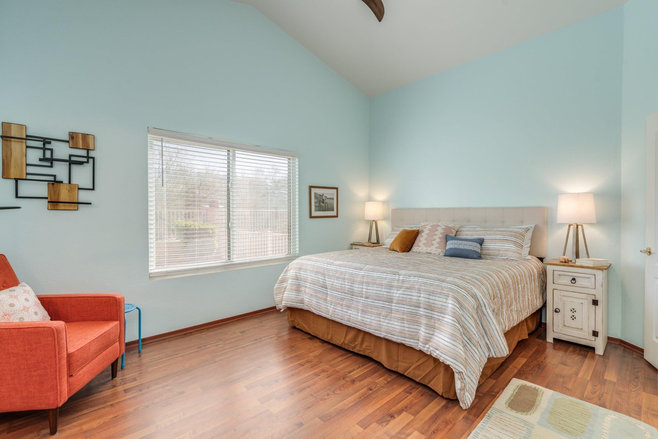 King size bed, reading area, and ensuite bathroom.