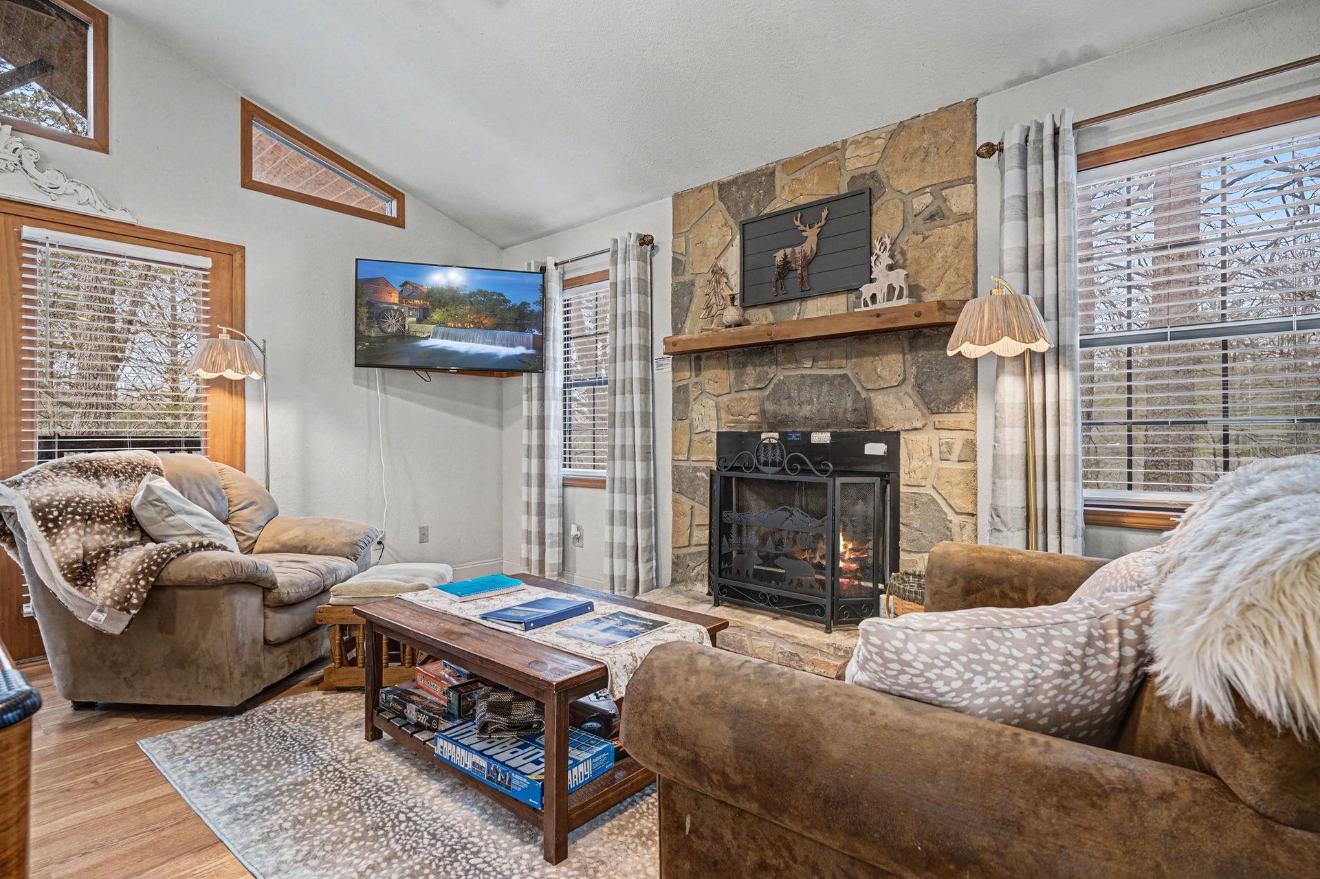 Sink into plush seating by your crackling fireplace, where cozy throws and warm lighting create the perfect retreat after mountain adventures.