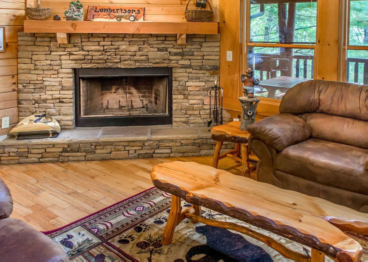 Cozy up by the woodburning fireplace in the living room.