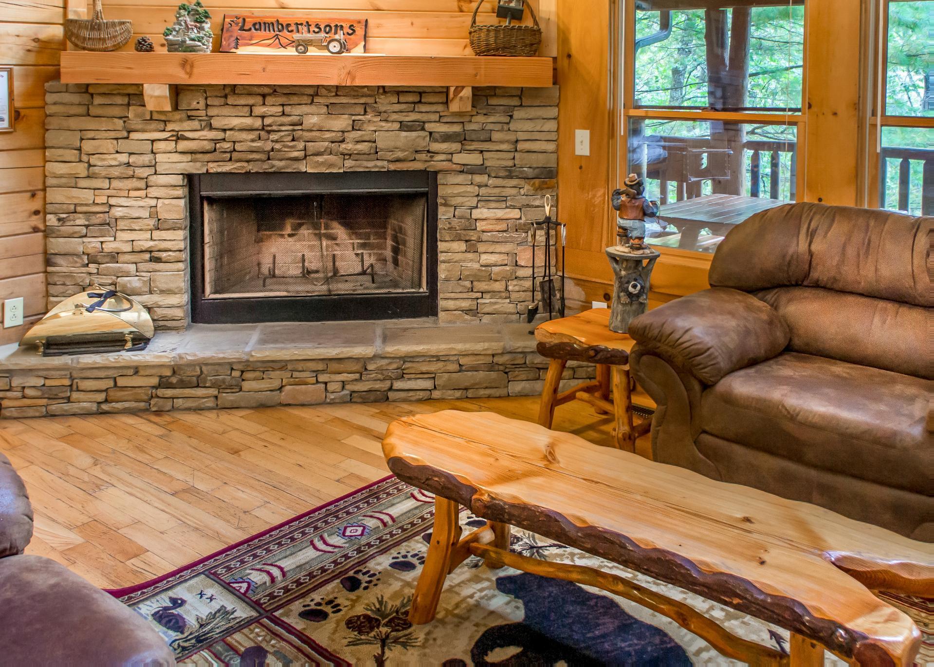 Cozy up by the woodburning fireplace in the living room.