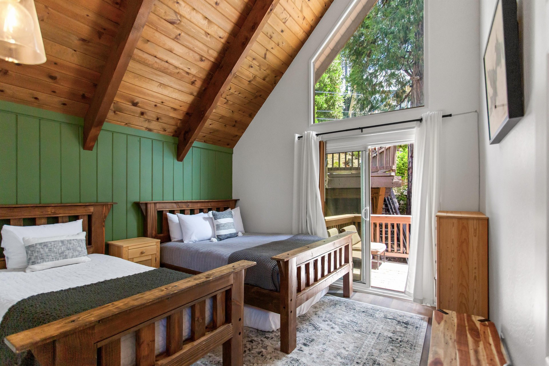 Queen and twin size beds, shared deck access.