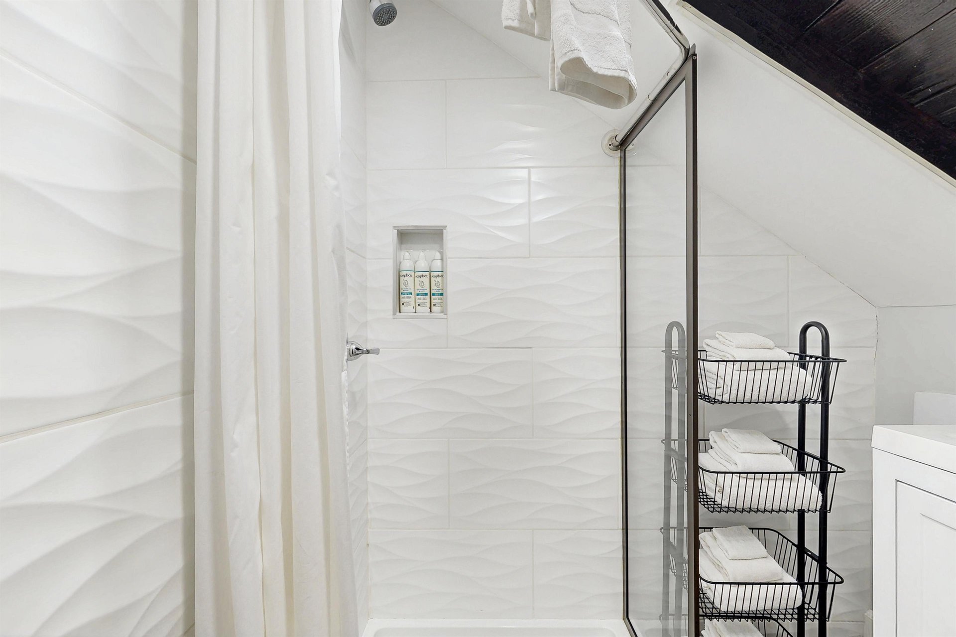 Ensuite primary bathroom with stand alone shower.