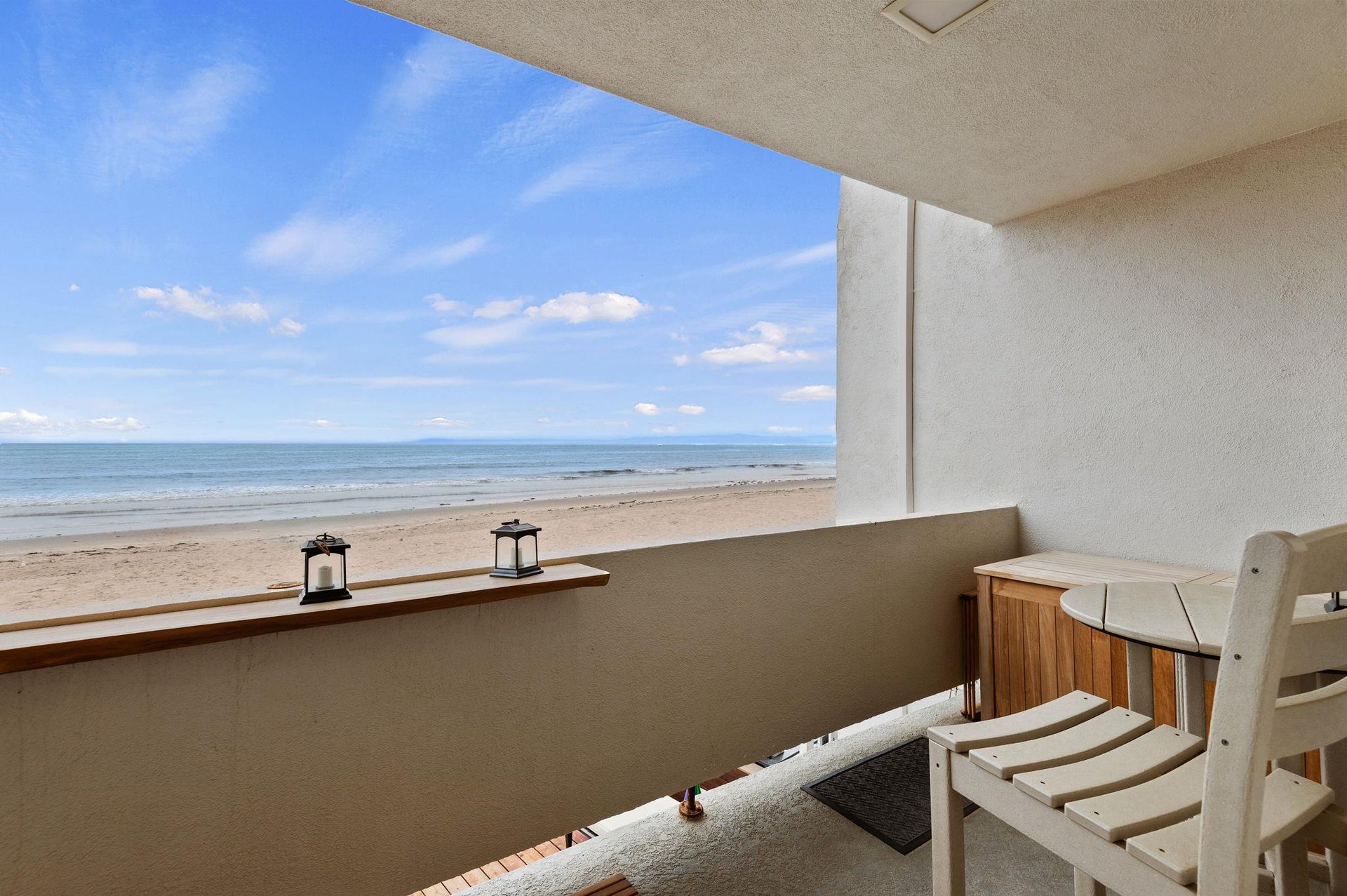 Bar top and two chairs. There is also a deck storage box to store your beach gear.