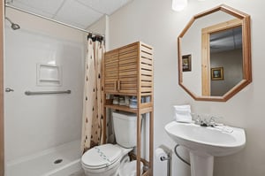 Your private bathroom features a spacious walkin shower, convenient storage, and all essentials for a comfortable stay.