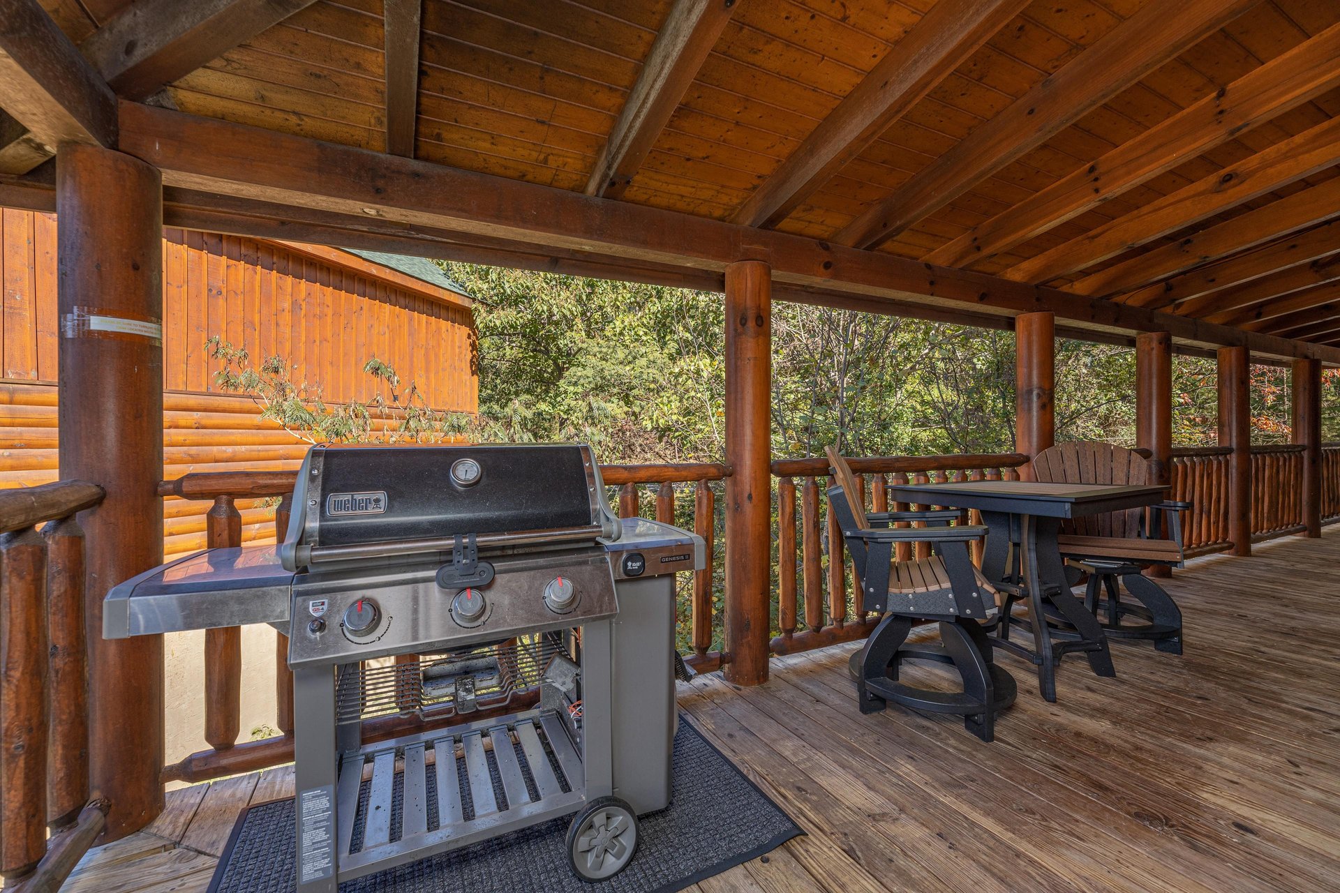 Gas grill on a covered deck at Bears Dont Bluff, a 3 bedroom cabin rental located in Pigeon Forge