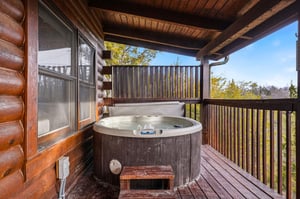Soak in your private hot tub while enjoying mountain views from this covered deck sanctuary.