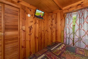 TV in a bedroom at Heavenly Hideaway, a 2bedroom cabin rental located in Gatlinburg