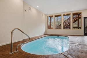 Slip into your private hot tub sanctuary, where warm bubbling waters and forest views create the perfect escape for relaxation.