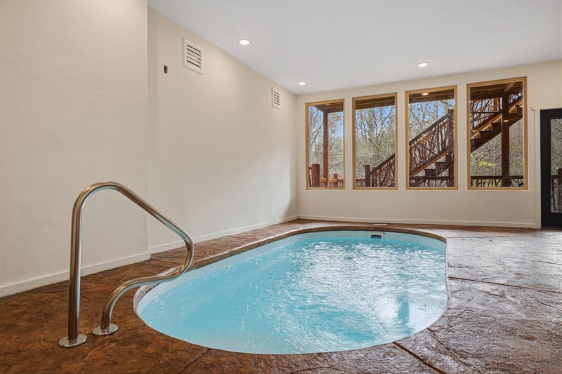 Slip into your private hot tub sanctuary, where warm bubbling waters and forest views create the perfect escape for relaxation.