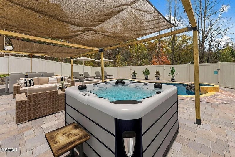 Soak away your stress in this private hot tub, perfectly positioned under shade with poolside lounge seating nearby.