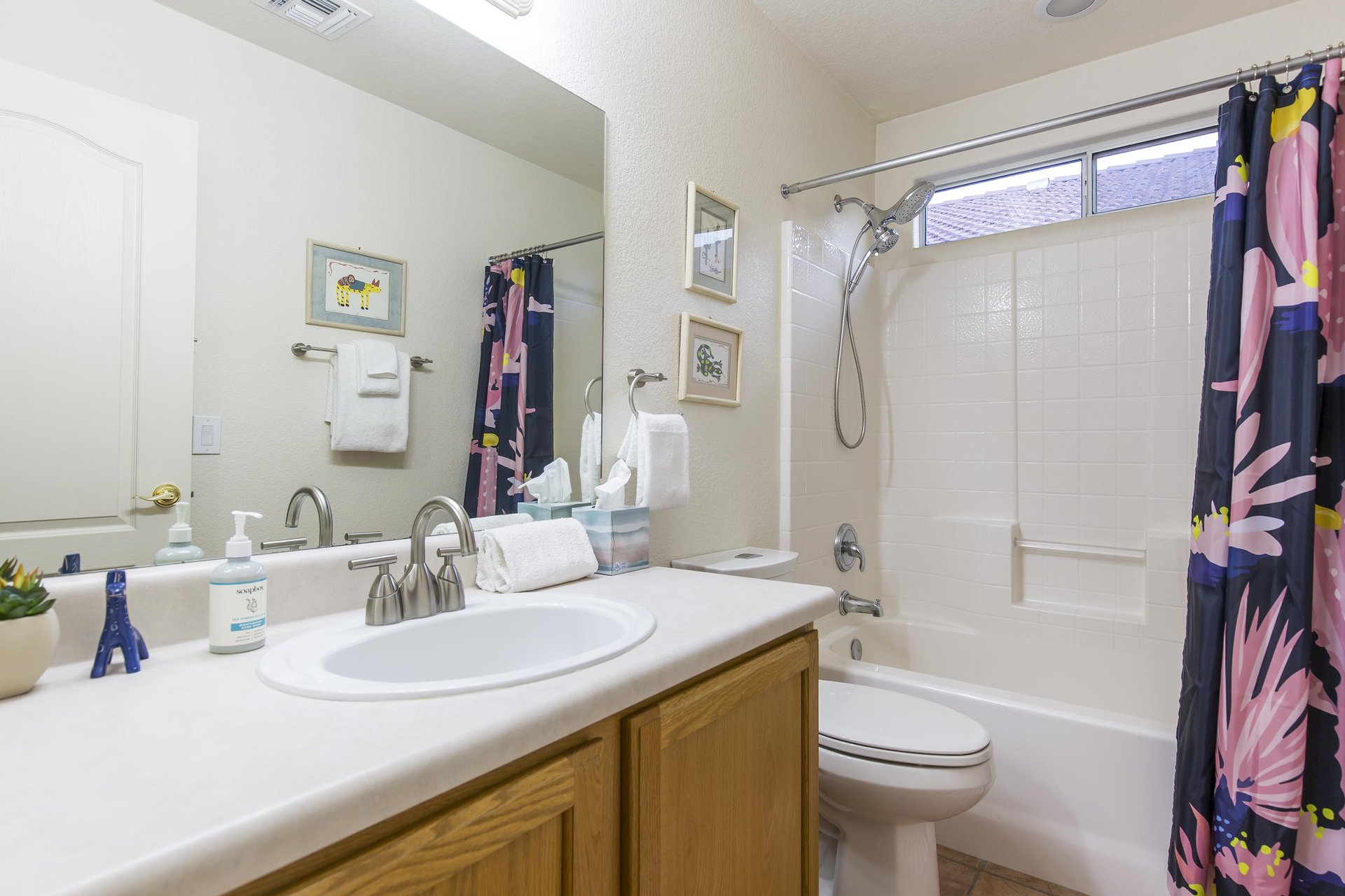 Guest bathroom with showertub combination.