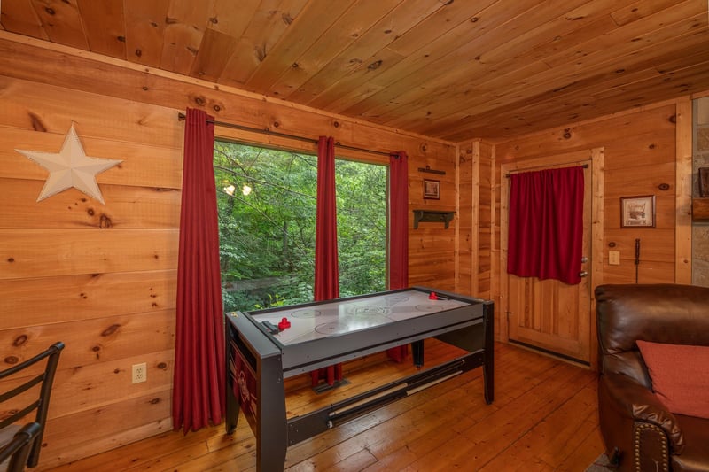 Air hockey table at Logans Smoky Den, a 2 bedroom cabin rental located in Pigeon Forge