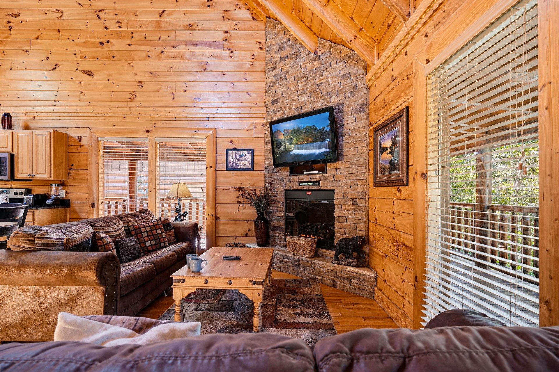 Sink into plush seating by the stone fireplace and let the natural light streaming through floortoceiling windows envelop you in warmth and tranquility.