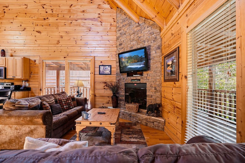 Sink into plush seating by the stone fireplace and let the natural light streaming through floortoceiling windows envelop you in warmth and tranquility.