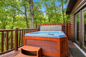 Soak under the trees in your private hot tub, surrounded by peaceful forest views and the sounds of nature.