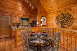 Dining table for four at Kellys Cabin, a 1 bedroom cabin rental located in Pigeon Forge