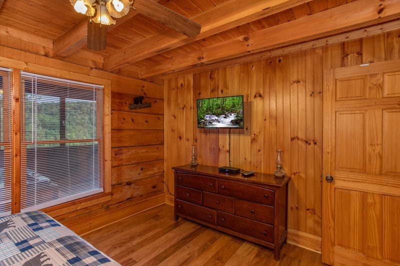 King bed facing tv and dresser