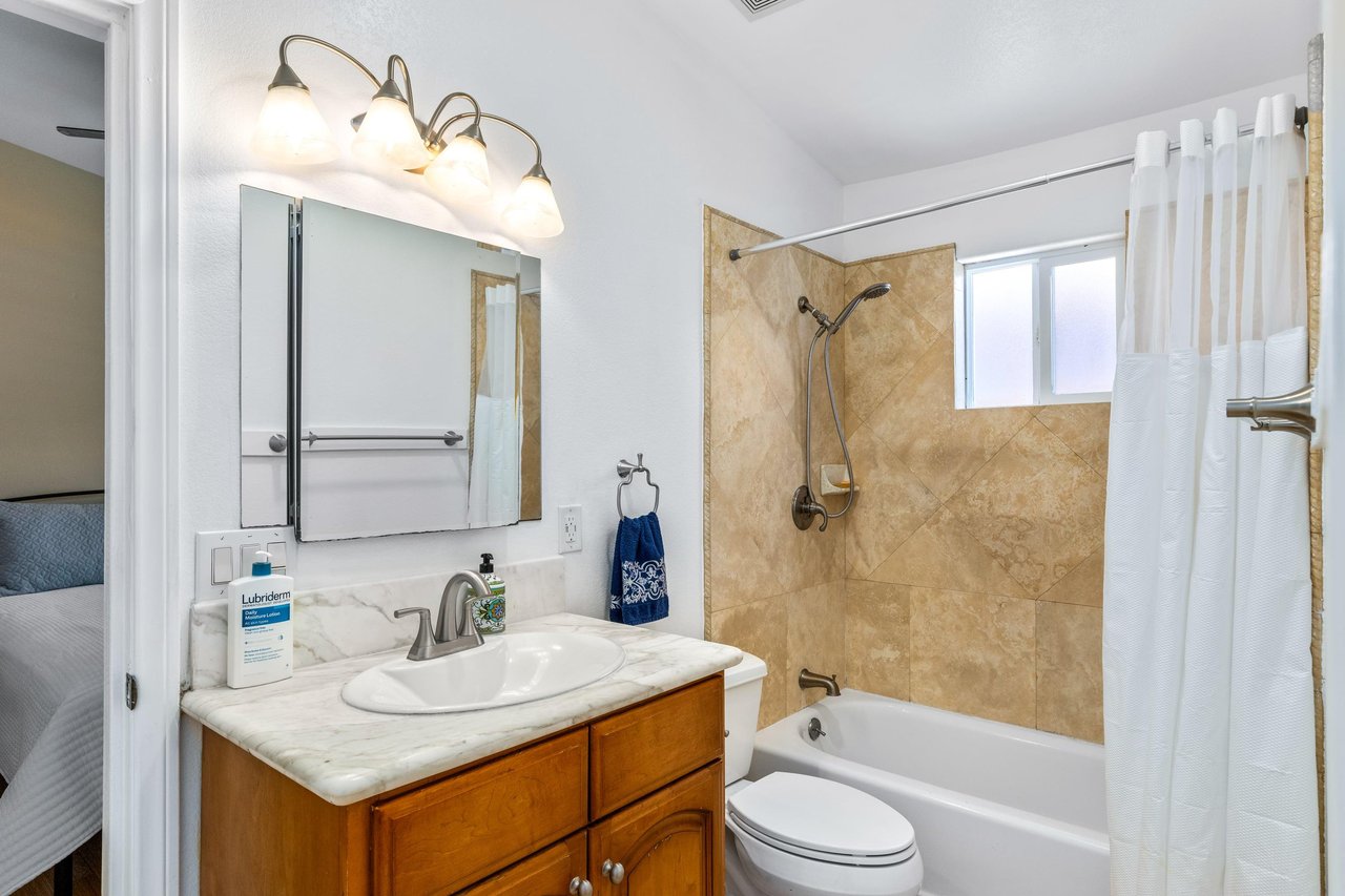Guest bathroom with showertub combination.