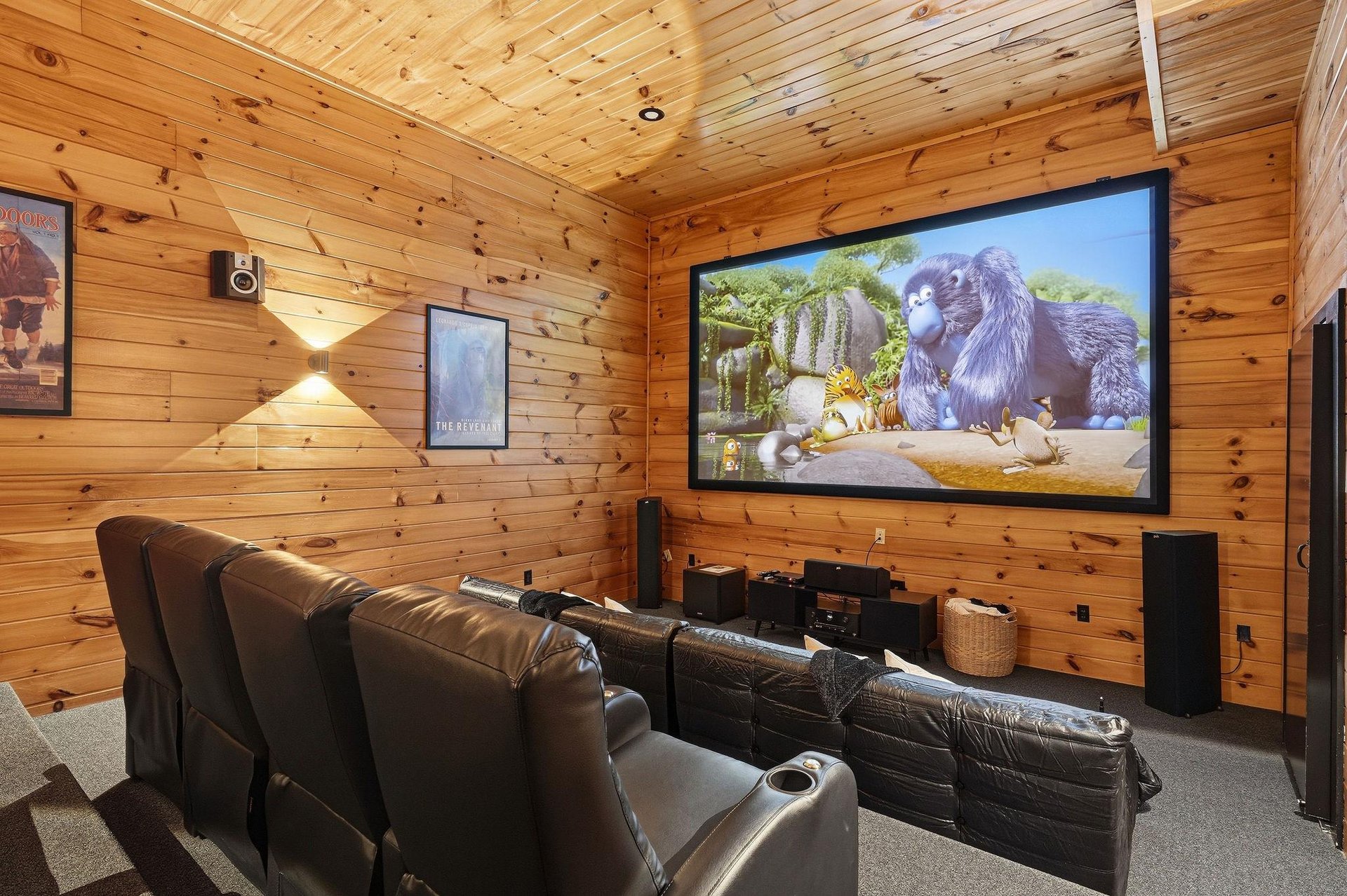 Settle into plush leather seating and enjoy your favorite films on the big screen in this private home theater, complete with surround sound for an immersive movie night experience.