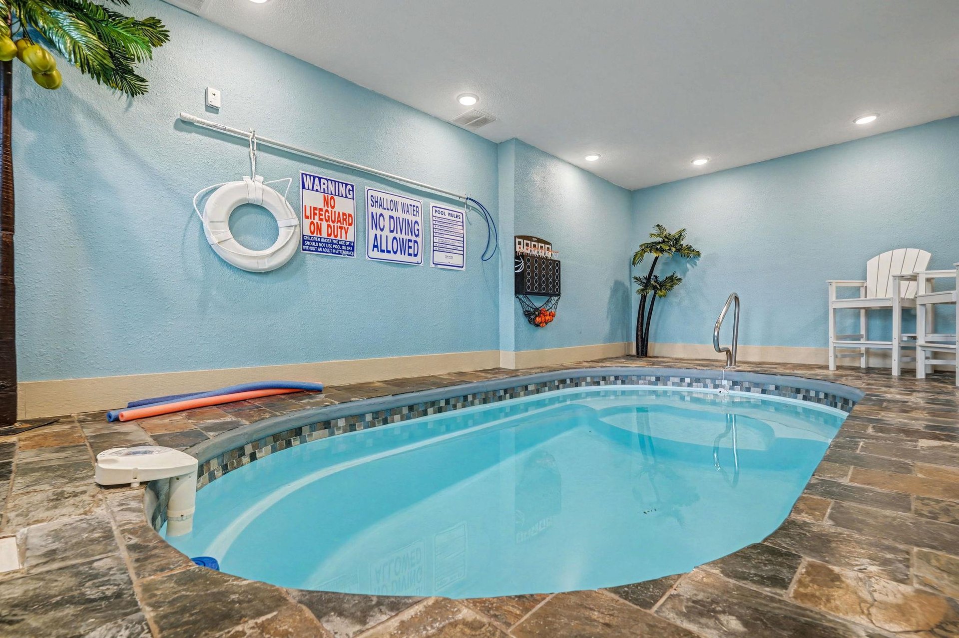 Dive into your own private oasis with this tropicalthemed indoor pool, complete with palm decorations and beach vibes yearround.