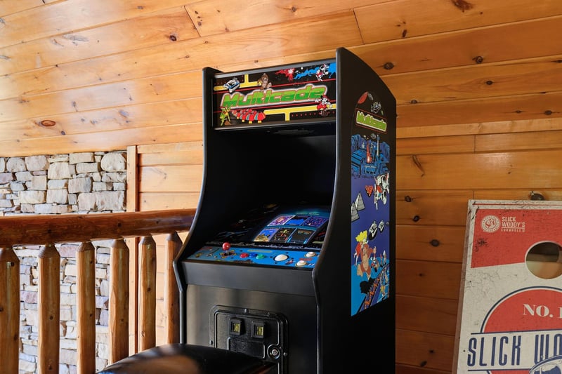 Classic arcade game brings retro fun to your mountain retreat. Challenge friends to high scores in this cozy game room corner.