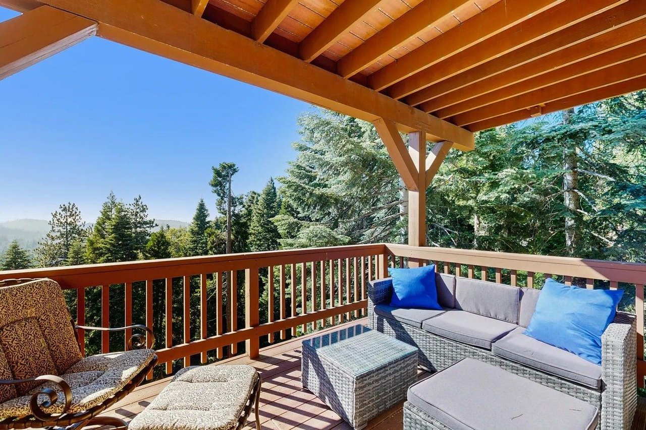 Beautiful, expansive deck with mountain  treetop views, outdoor dining, and BBQ.