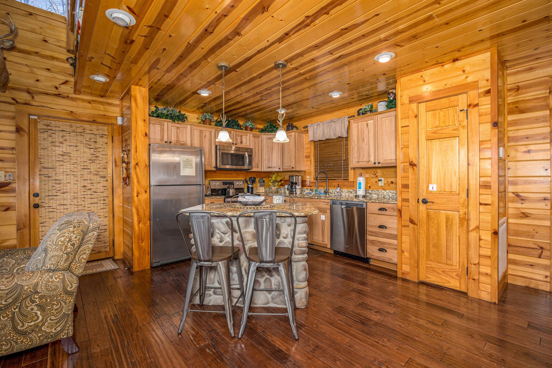 Full kitchen with island and chairs