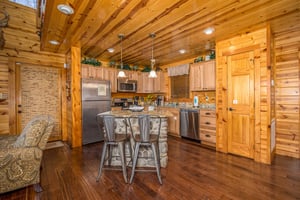 Full kitchen with island and chairs