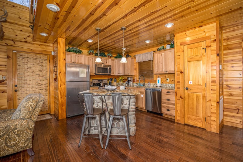Full kitchen with island and chairs