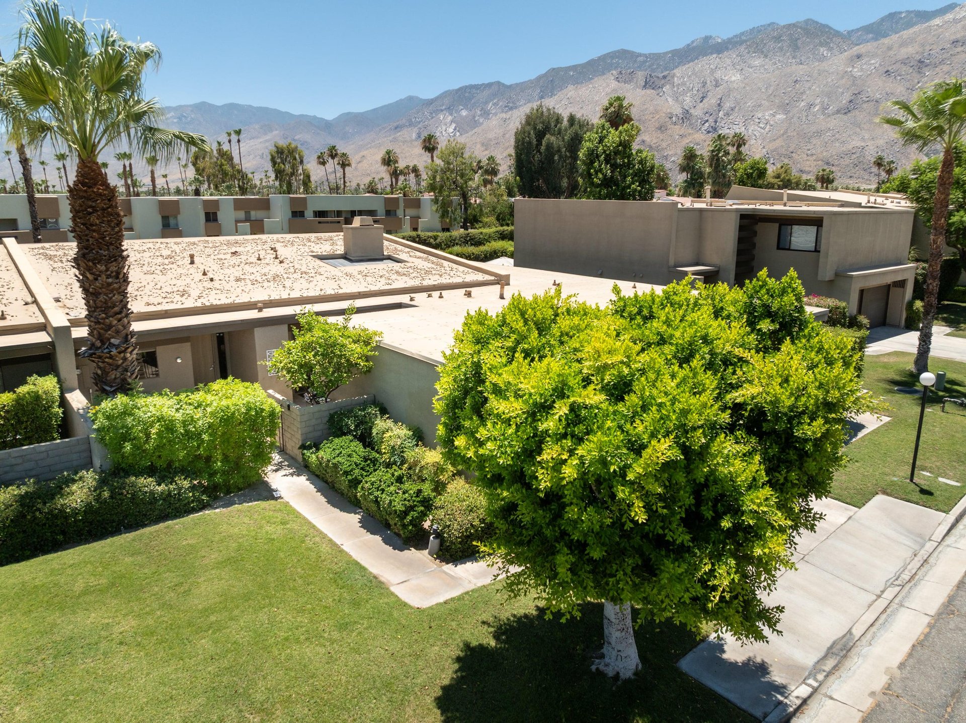 Additional view of the front entrance to the home, driveway, and garage.