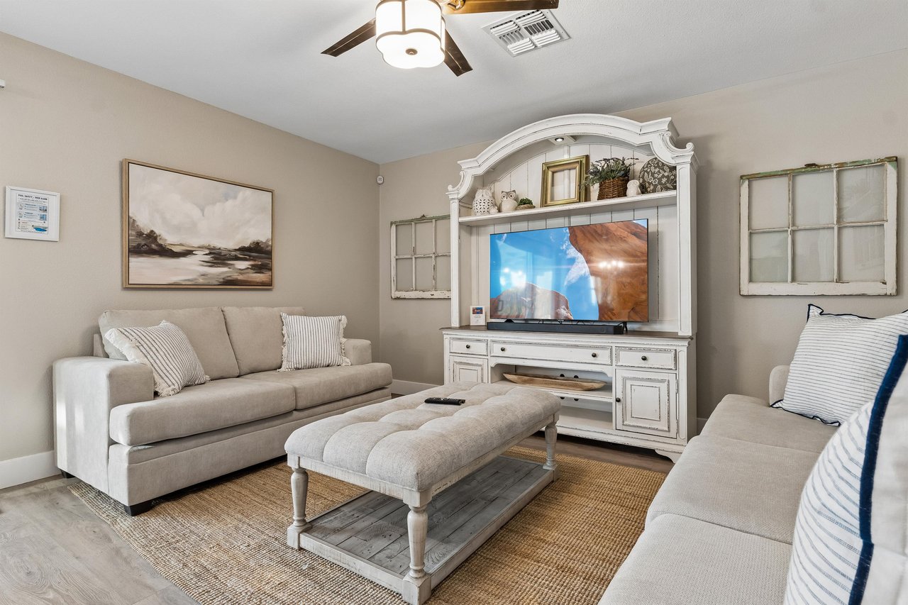 Flatscreen TV and cozy seating.