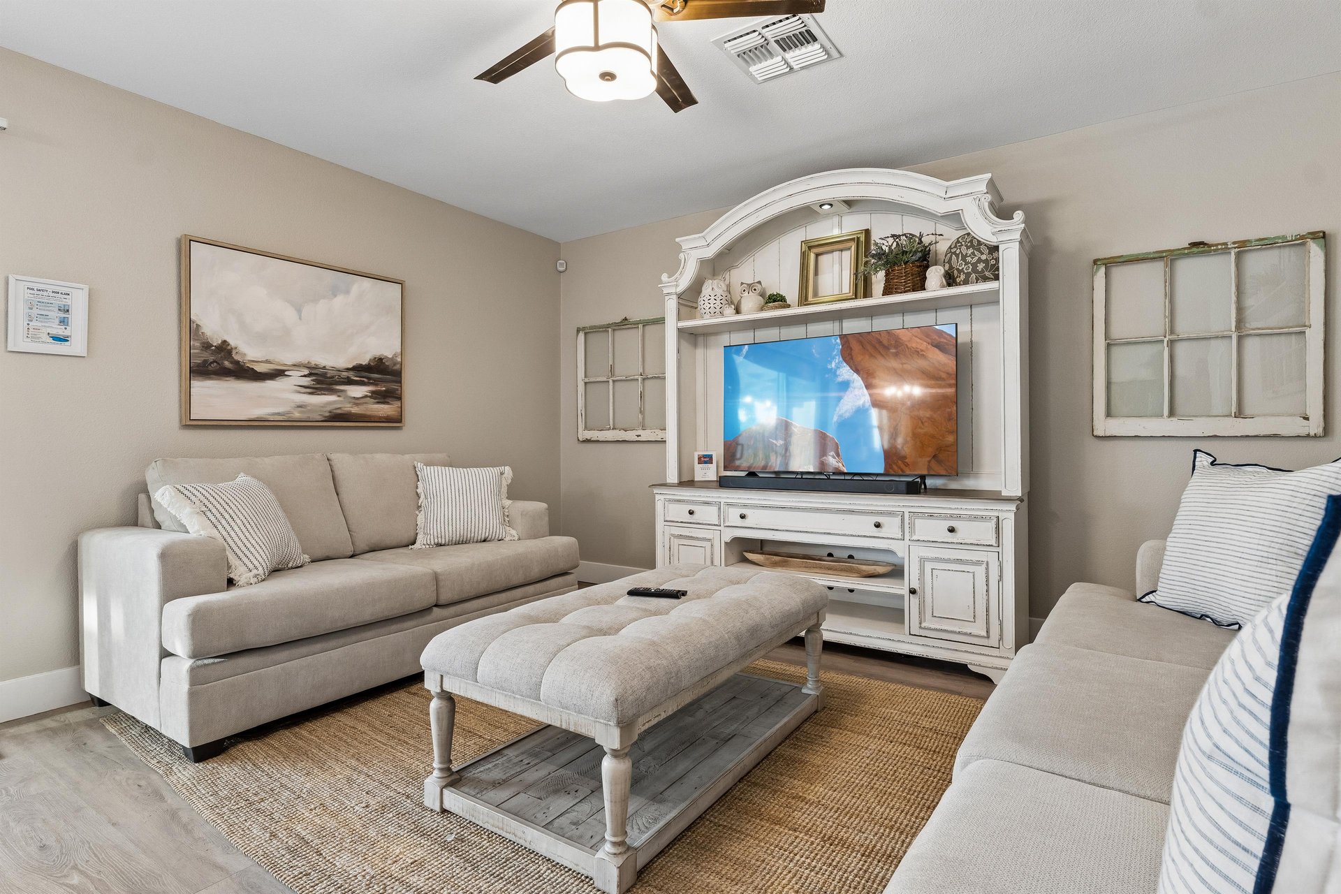Flatscreen TV and cozy seating.