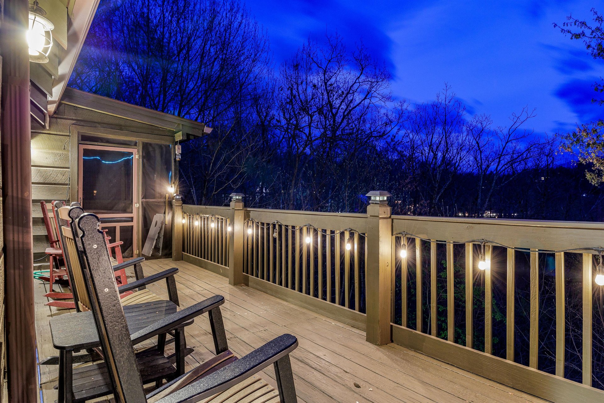 Night view from lit cabin deck