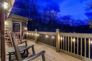 Night view from lit cabin deck