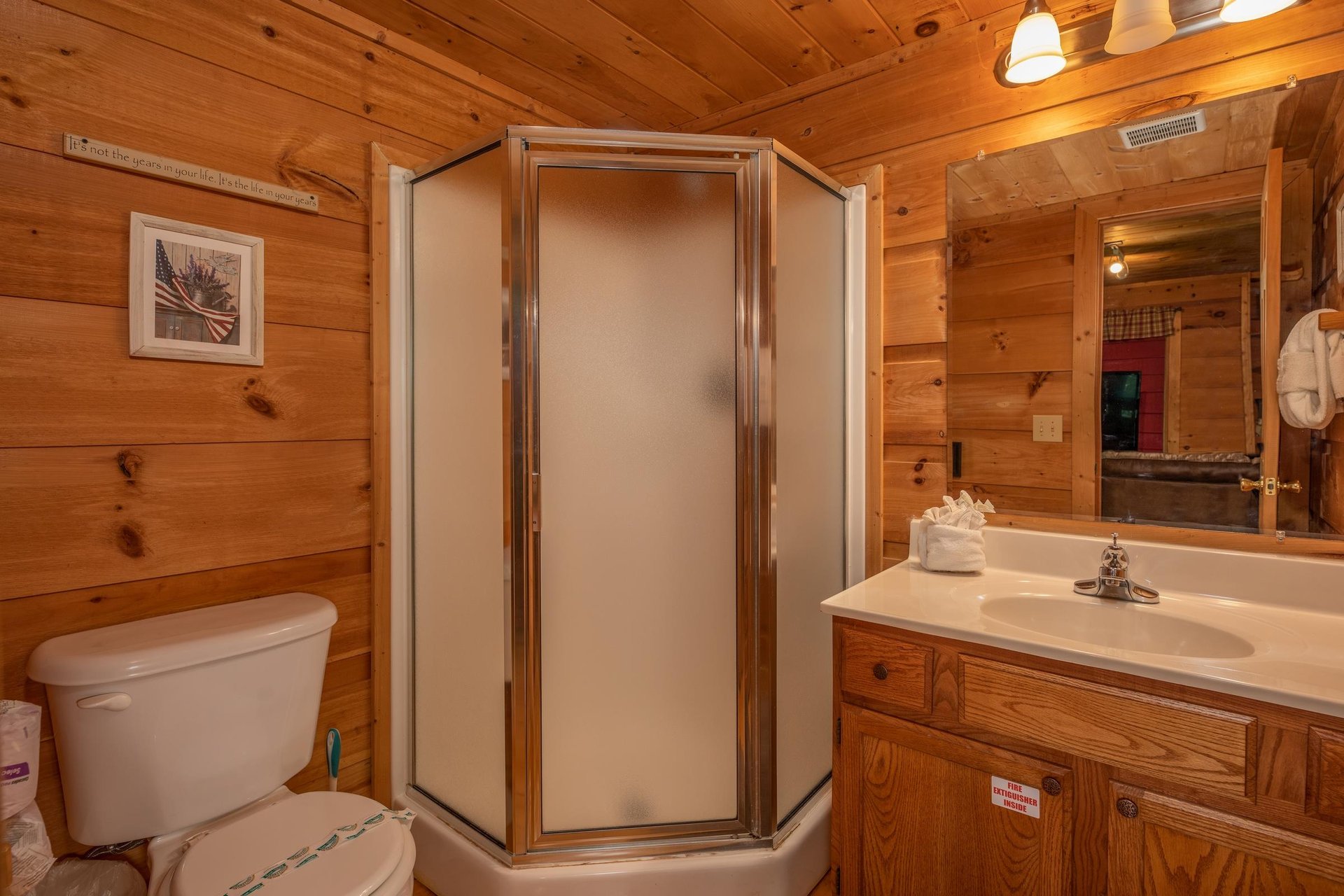 Bathroom with a corner shower at Logans Smoky Den, a 2 bedroom cabin rental located in Pigeon Forge