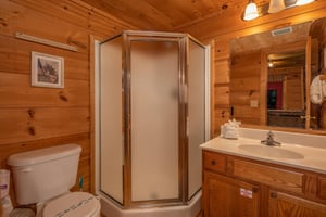 Bathroom with a corner shower at Logans Smoky Den, a 2 bedroom cabin rental located in Pigeon Forge