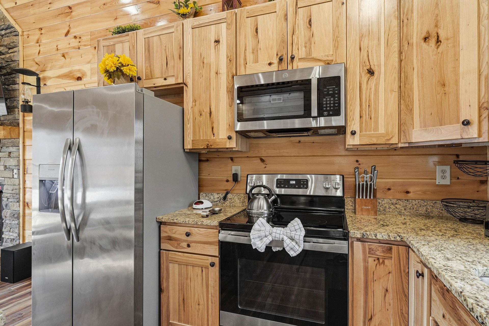 Your fully equipped kitchen welcomes you with warm wood cabinets and modern appliances for memorable meals together.
