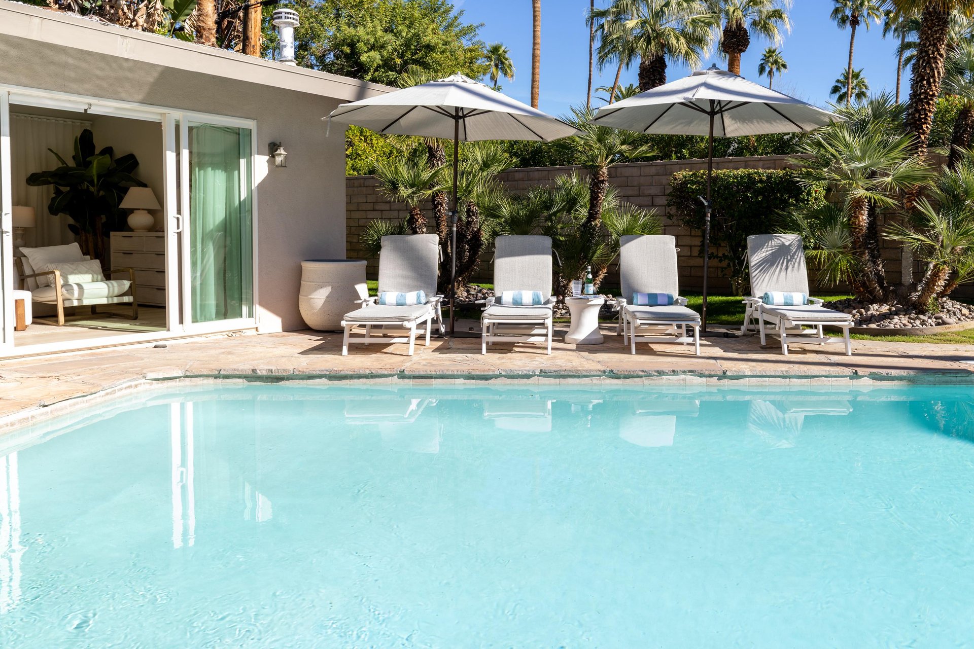 Sink into plush poolside loungers