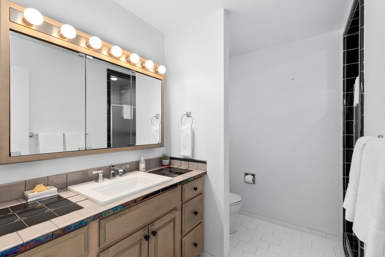 Vanity area with counter space.