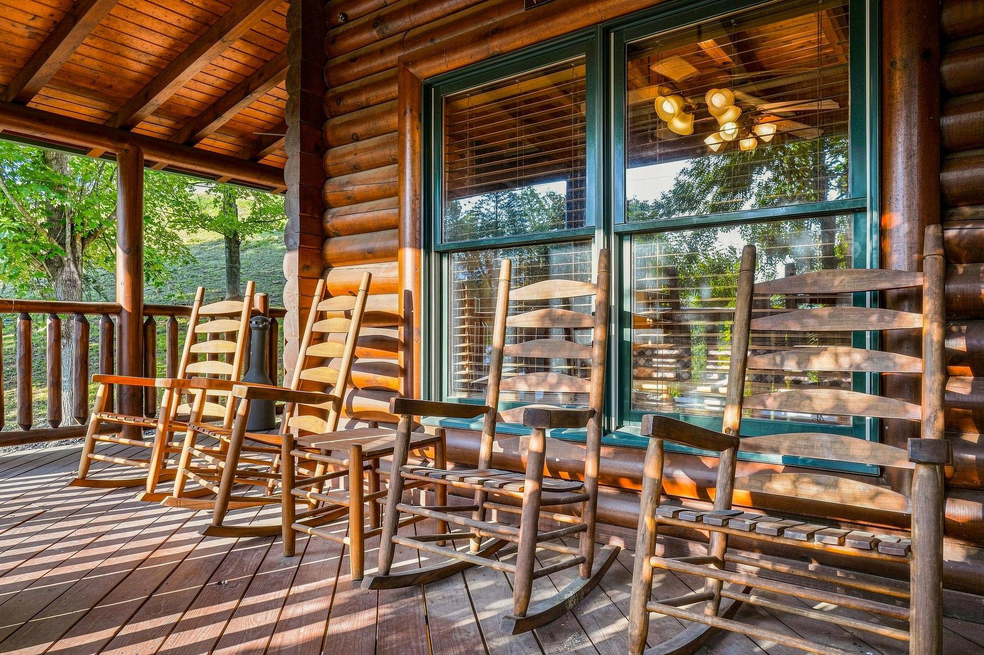 Your private covered porch invites you to unwind in a rocking chair, soak in mountain views, and savor peaceful mornings or starlit evenings in pure relaxation.