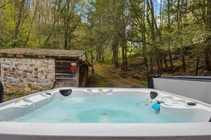 Soak in your private hot tub surrounded by peaceful woodland, where rustling leaves create natures soundtrack for your ultimate relaxation.