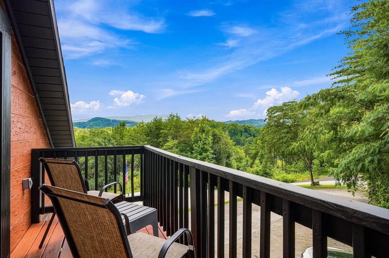A private balcony overlooking lush rolling hills and forested mountains. Sit back and soak in the peaceful natural beauty from your serene outdoor retreat.